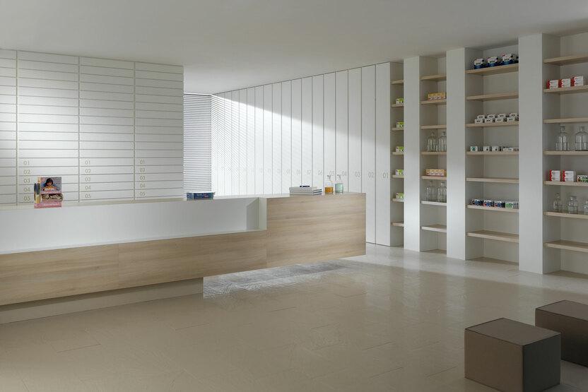 Impressionen einer Apothekeneinrichtung Impressionen einer Apothekeneinrichtung mit hellen Holzmöbeln und geräumigem Regalsystem, sowie aufgeräumten Empfang.